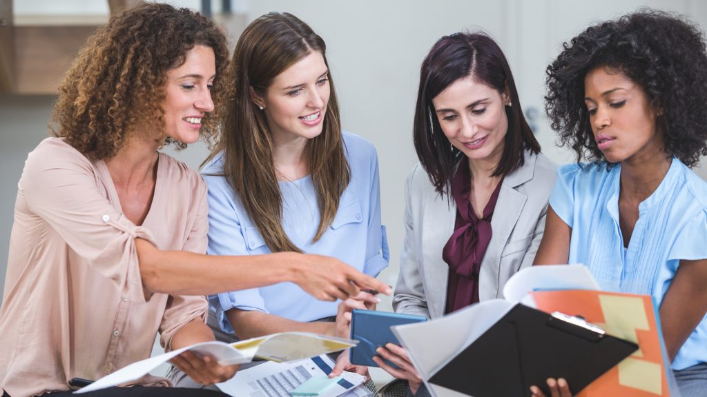 four female entrepreneurs in conversation